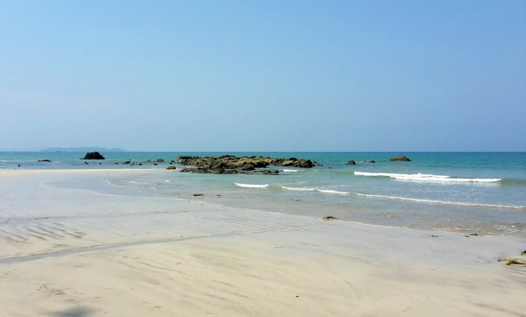 Golden sand and turquoise sea off at Ngapali Beach in Burma.