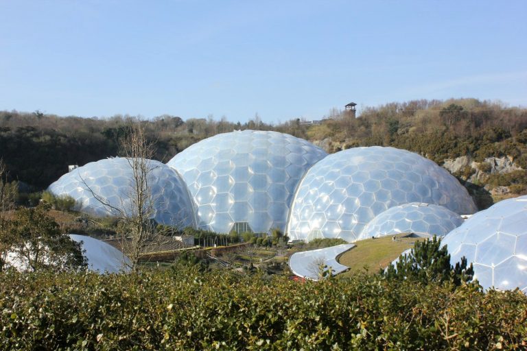 Biomes of the Eden Project in Cornwall against the blue sky - the Eden Project with kids is a great day out for families and one of my top things to do in Cornwall with kids