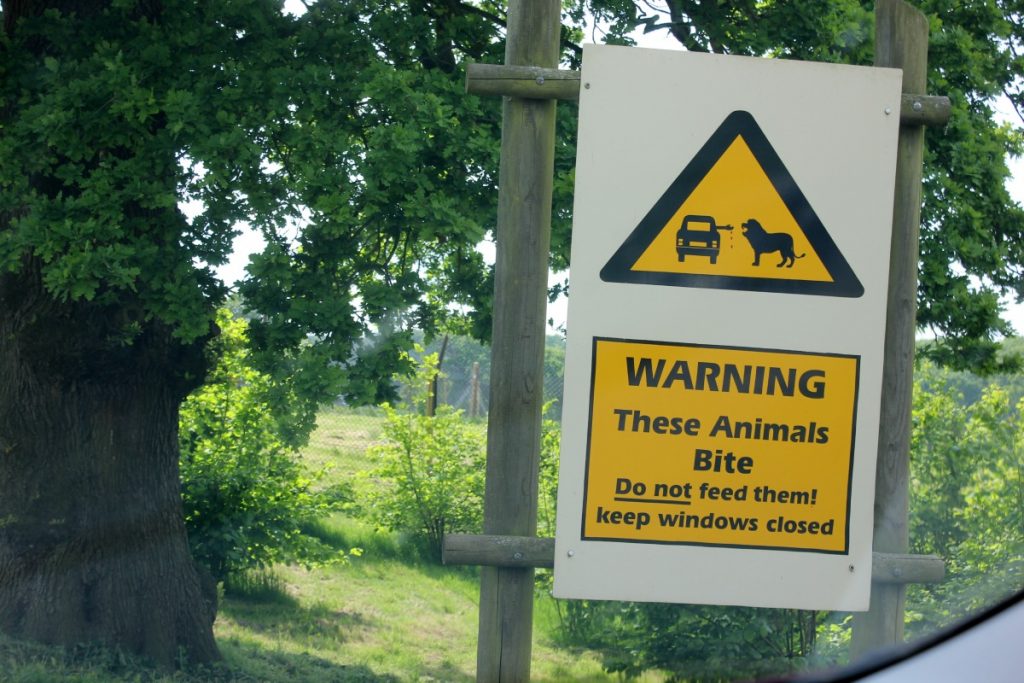 Warning sign not to get out of your car at Woburn Safari Park