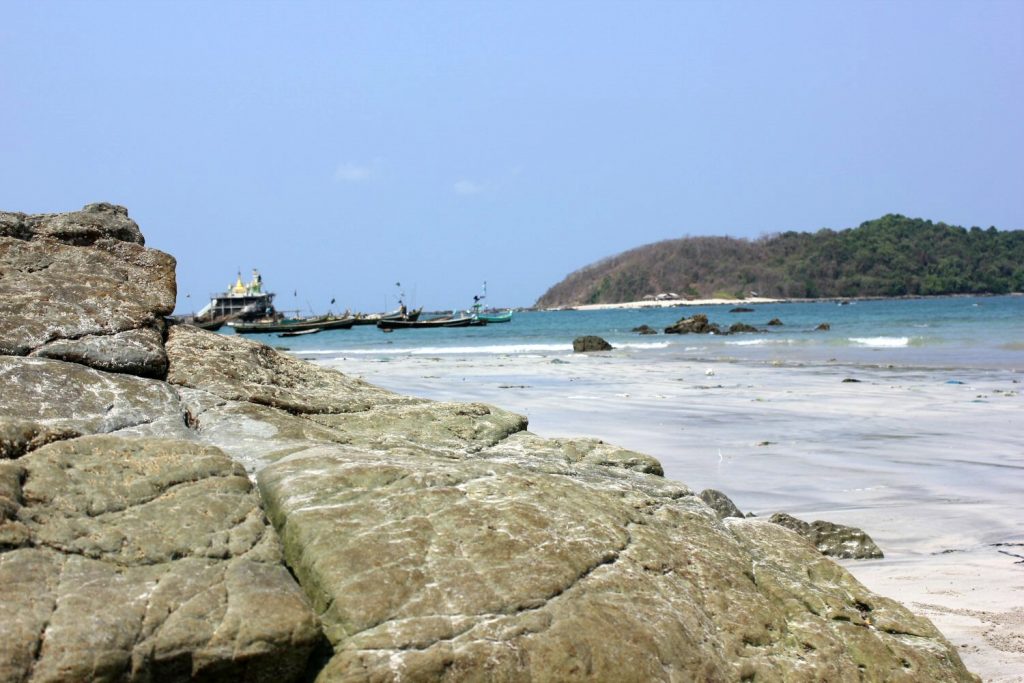 Looking out to boats on the turquoise waters off Ngapali Beach - discovering another side to Burma beach holidays
