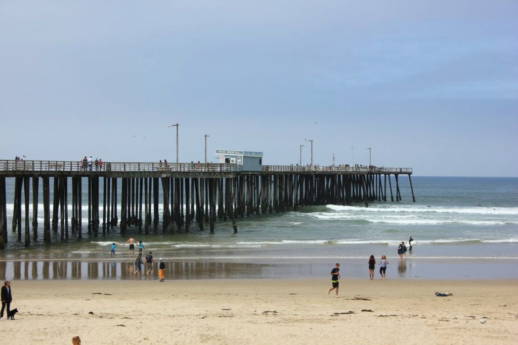 View of the pier across the sand at Pismo beach - my Pacific Coast Highway pictures and reasons to visit California