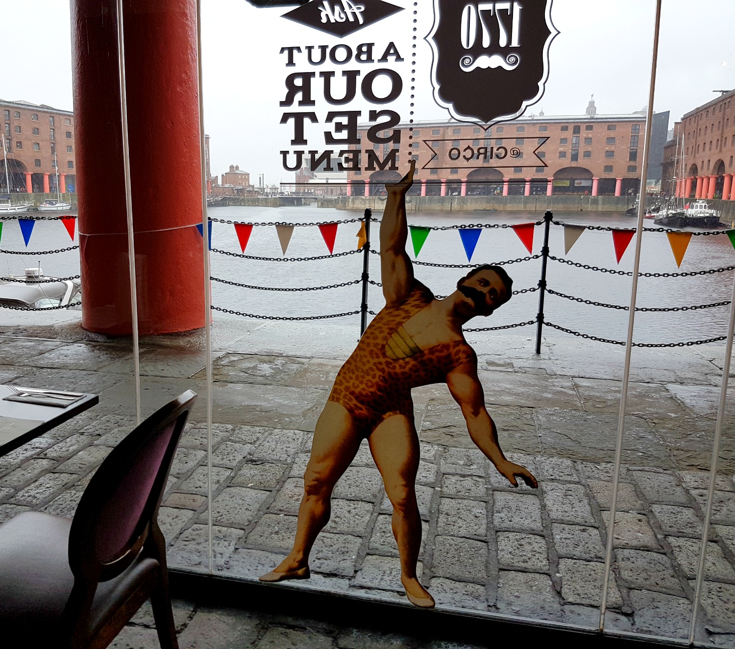 Strongman window decoration at Circo restaurant on Albert Dock, Liverpool - my Albert Dock review with kids
