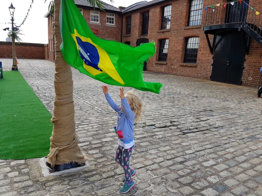 My daughter jumps to catch a Brazilian flat at Albert Dock, Liverpool - exploring the Albert Docks kids' attractions. and my Albert Dock review