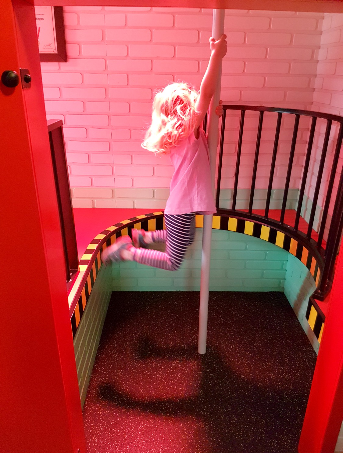 My daughter on a pole in the fireman Sam section of Mattel Play, one of the main Albert Dock kids attractions