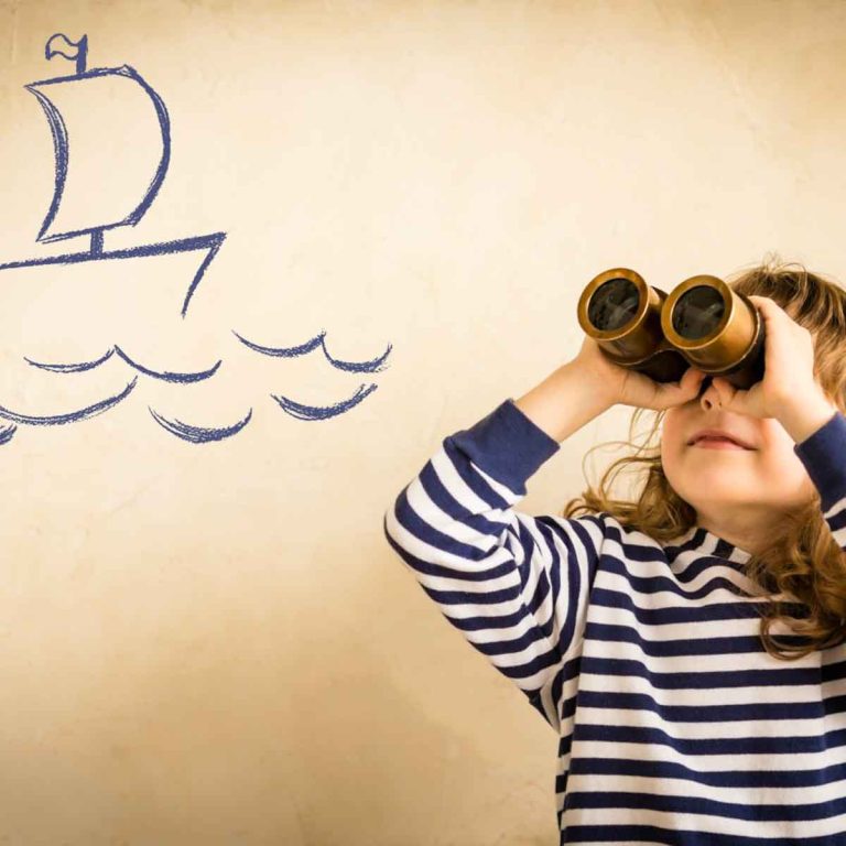 Girl in stripy top with binoculars imagining sailing boat on the waves - how to choose a family cruise and my top tips on finding the perfect cruise holiday with kids