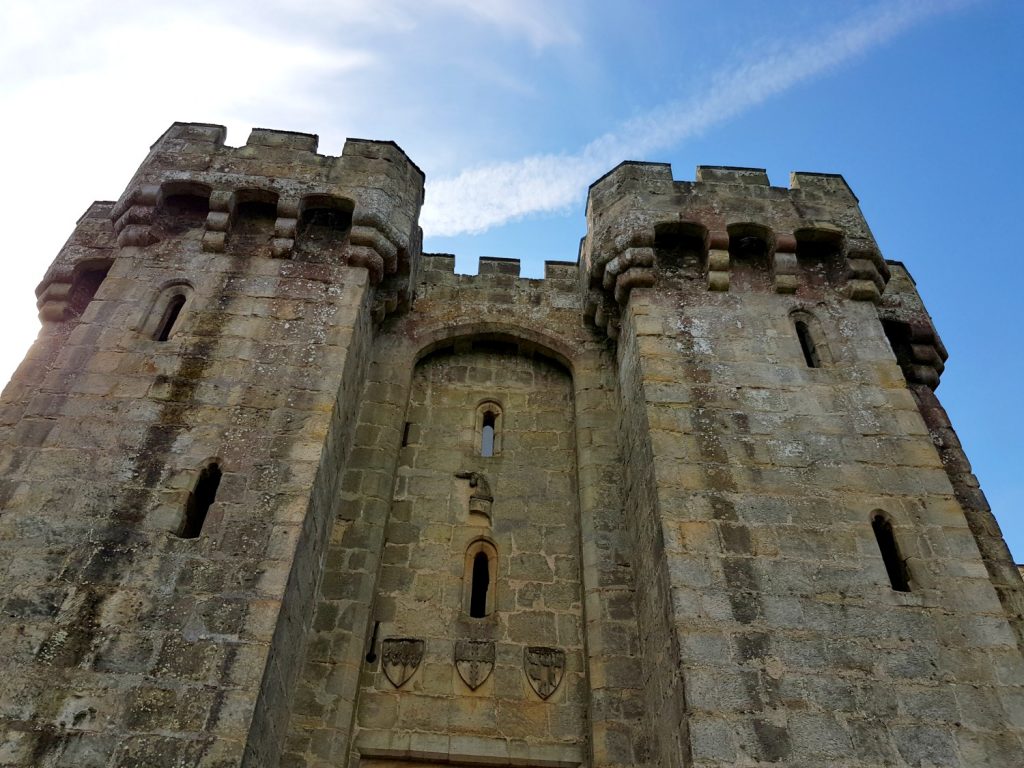A view of the gatehouse at beautiful Bodiam Castle in East Sussex against blue sky - my review and why it's great to visit Bodiam Castle with kids