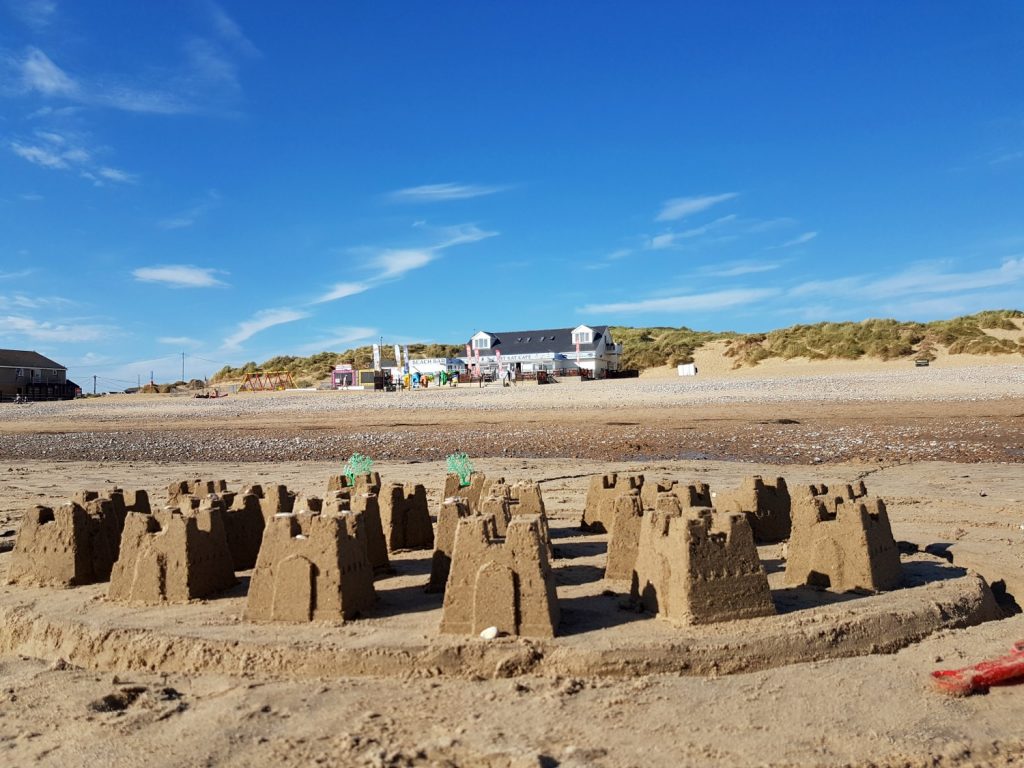 sandcastles on Camber Sands beach in East Sussex - spending a weekend in East Sussex with my daughter before the start of school, to explore the history and coastline