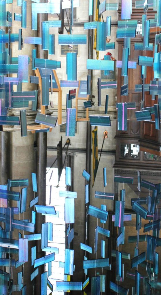 reflection of the blue glass in the sculpture hanging above the font at Salisbury cathedral - my visit to Salisbury cathedral with kids