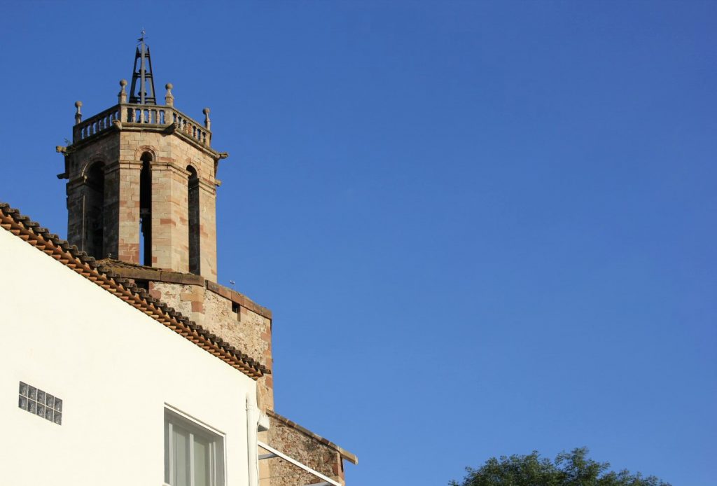 View of part of the imposing tower of the church at Caldes de Montbui. My photo tour of Costa Barcelona