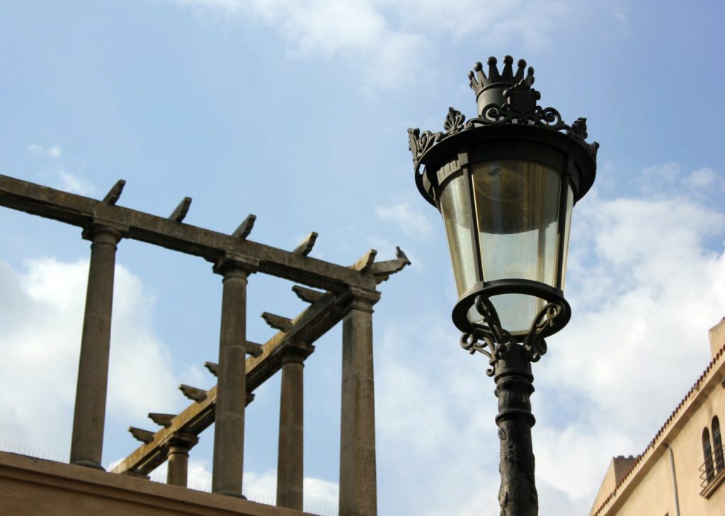 View of a metal lampost and part of the building above the baths at Caldes de Montbui. My photo tour of Costa Barcelona