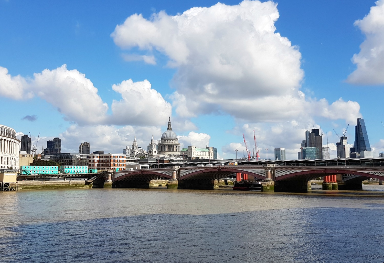 View along the Thames with one of the bridges and St Paul's visible