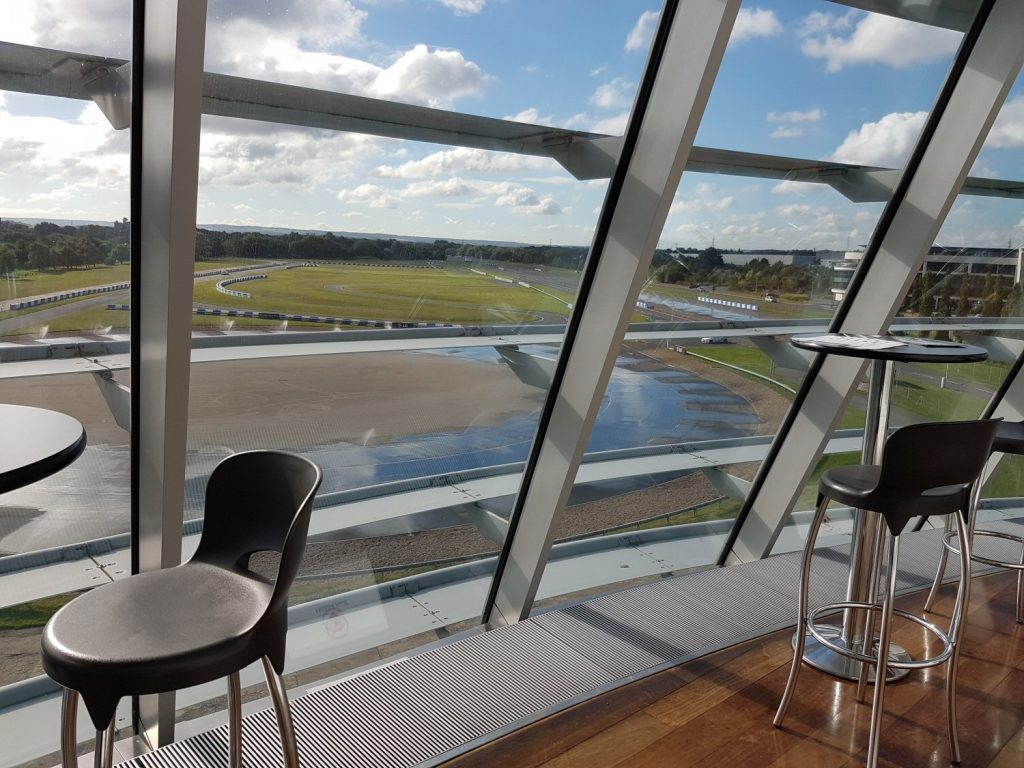The indoor viewing gallery looking out over the track of Mercedes Benz World - my review of our stay at Brooklands Hotel with kids