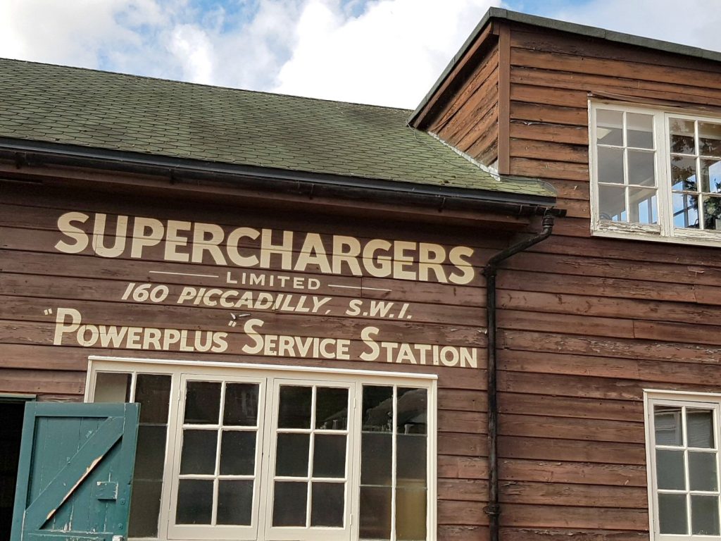 One of the old buildings with its painted sign at Brooklands Museum, Surrey - my review of Brooklands Museum, one of my top family days out in Surrey