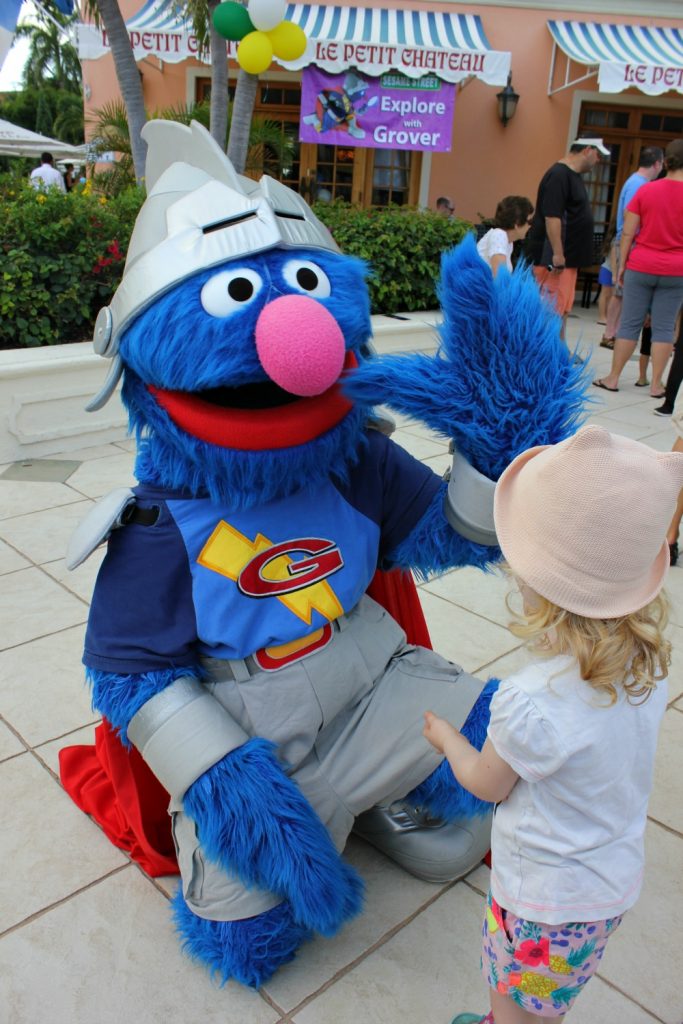 A small girl meets Super Grover - one of my 9 top reasons to visit Beaches Turks & Caicos with kids
