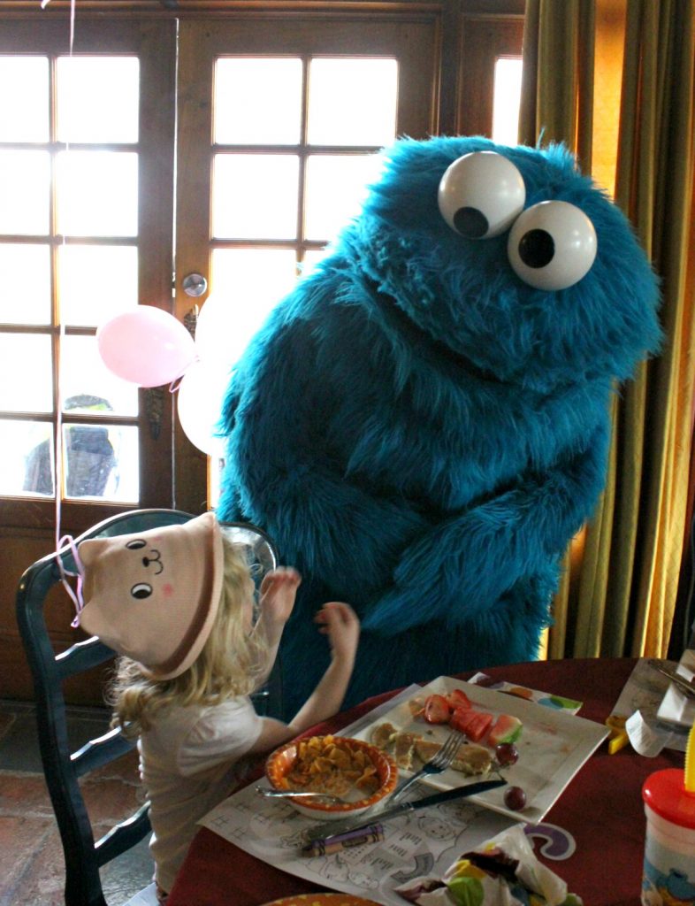 Small girls meets Cookie Monster - one of my 9 top reasons to visit Beaches Turks & Caicos with kids