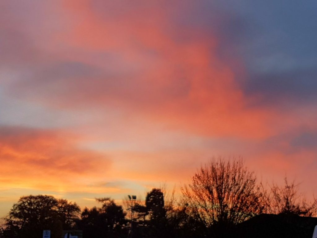 Red clouds at sunset at Willows Activity Farm Santa Spectacular near St Albans in Hertfordshire - my review of our family day out