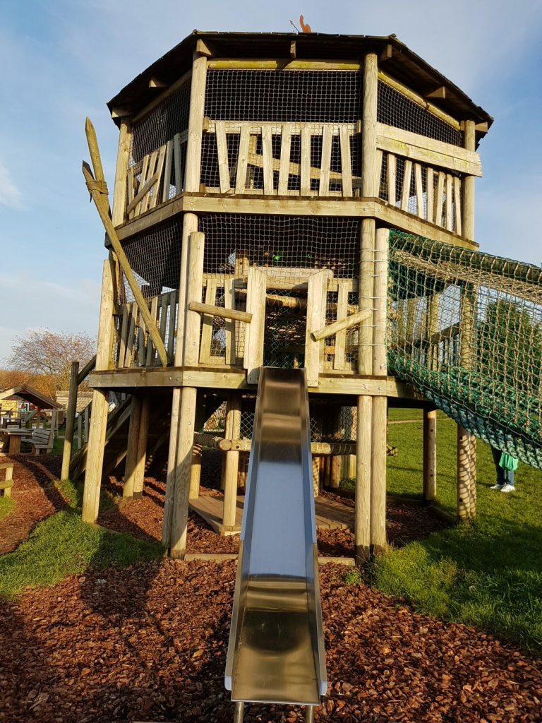 Slide and wooden tower in one of the play areas at Willows Activity Farm Santa Spectacular near St Albans in Hertfordshire - my review of our family day out