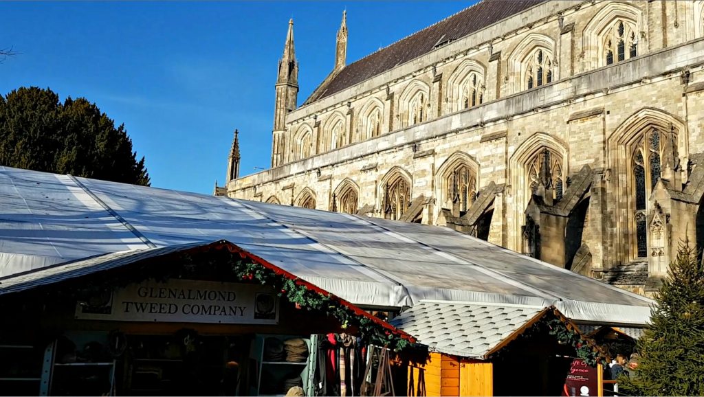 A view over the stalls to Winchester cathedral - our visit to Winchester Christmas market with kids