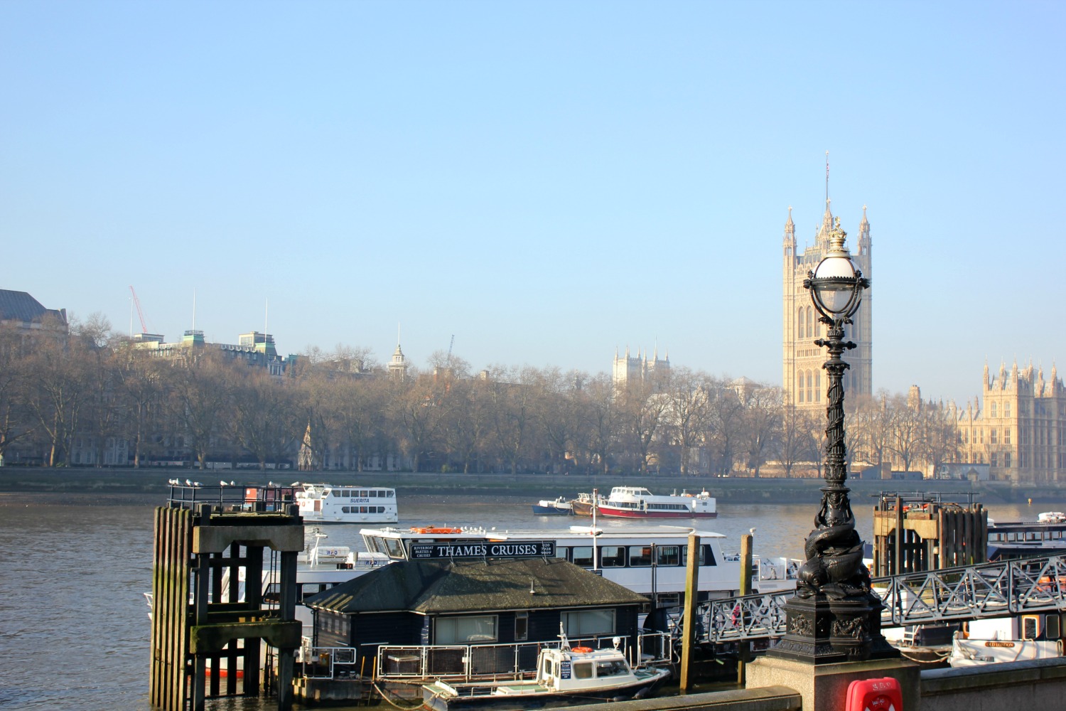 A view along the Thames to the Palace of Westminster, aka the Houses of Parliament - our mini tour of London's landmarks