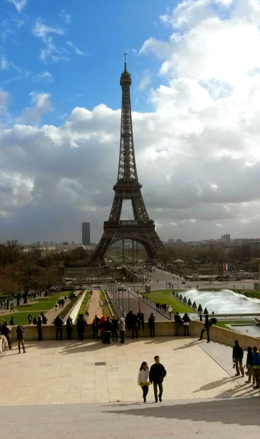 The Eiffel Tower in Paris seen from the Trocadero against a blue sky