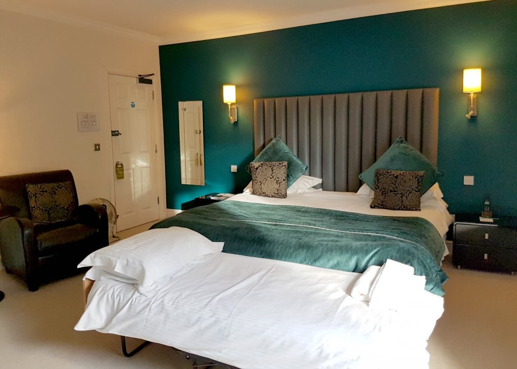 Huge double bed in our room at Fishmore Hall in Shropshire, UK - a boutique hotel with kids