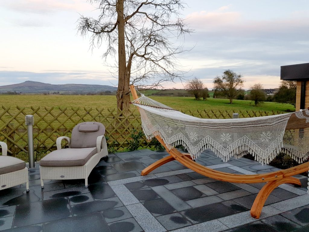 Relaxation area outdoor surrounded by fields at the spa at Fishmore Hall in Shropshire, UK