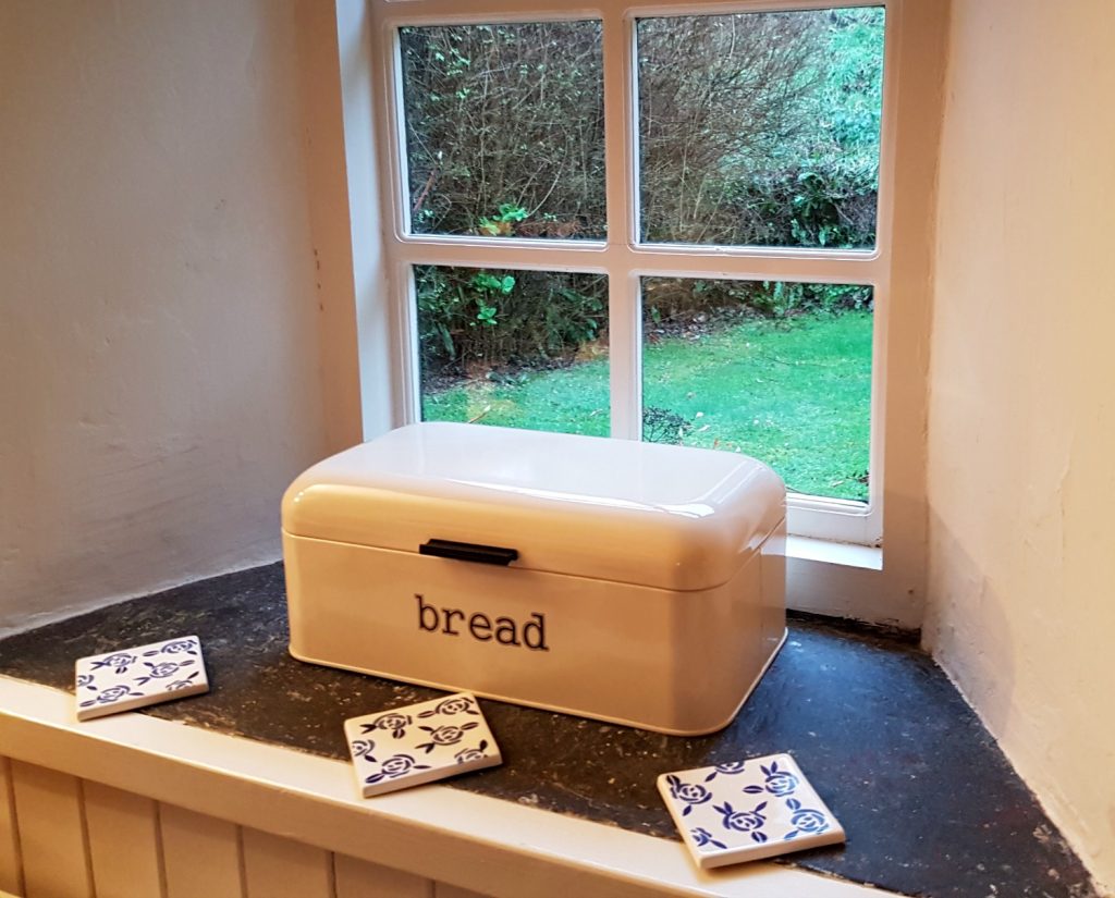 Bread bin by the windowsill at Clydey Cottages Pembrokeshire in Wales - my Clydey Cottages review, after our stay at this family-friendly holiday cottage