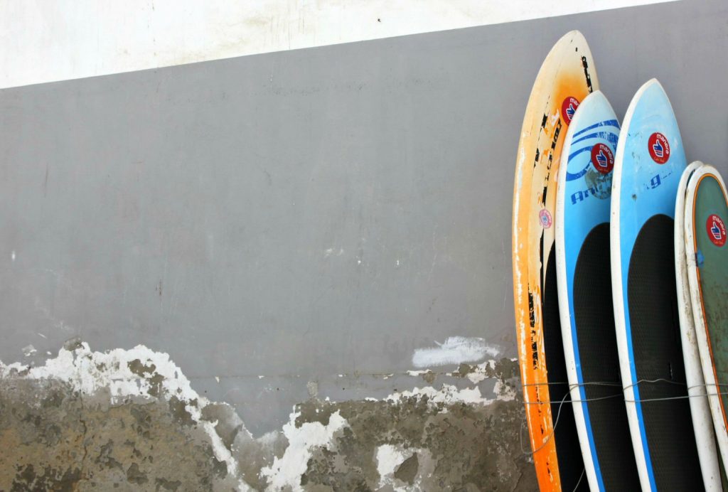 Boards stacked against a wall with peeling paint in Santa Maria on Sal - my top 19 Cape Verde things to know