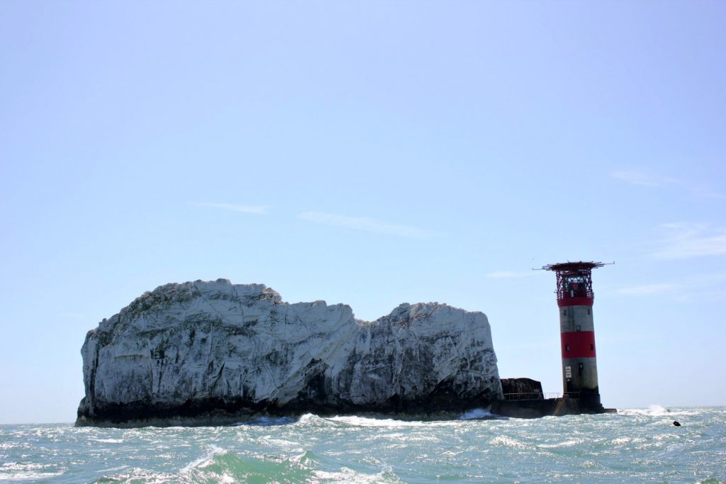 A view to The Needles and lighthouse from our boat - discovering the Isle of Wight coast
