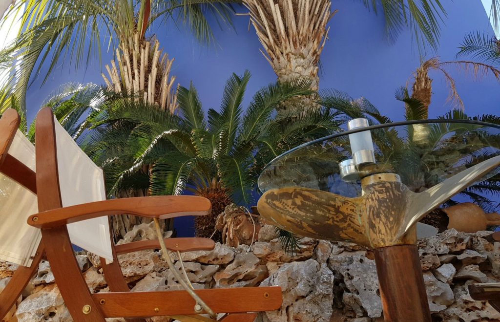 Propellor used in a table, part of the quirky decor at Iapetos Village on Symi in Greece - my Iapetos Village Symi review