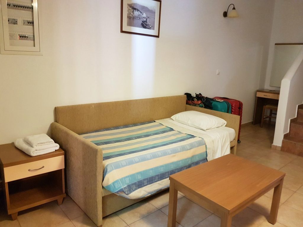 The sofa bed in the living room at Iapetos Village on Symi in Greece - my Iapetos Village Symi review