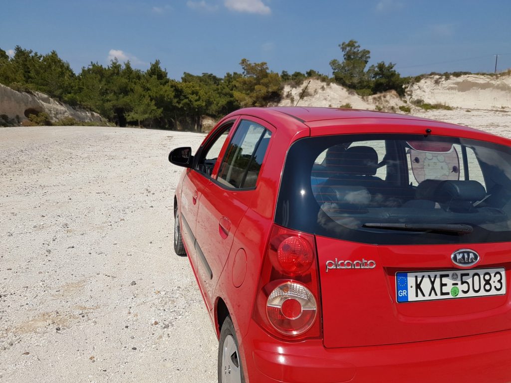 Our trusty red Kia Picanto (apart from ultra-stiff handbrake) for exploring Kos - one of my 13 reasons to choose Greek island hopping with kids