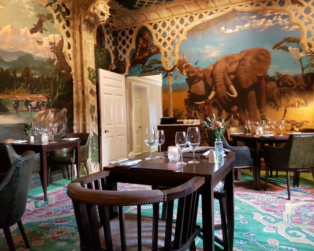 Murals on the walls of the hotel restaurant - my Rhino Lodge Port Lympne review