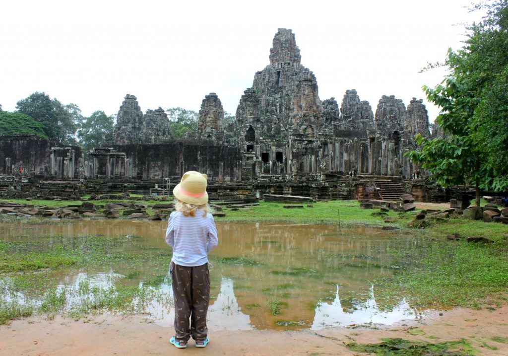 My daughter in front of Bayon temple - visiting Bayon with kids