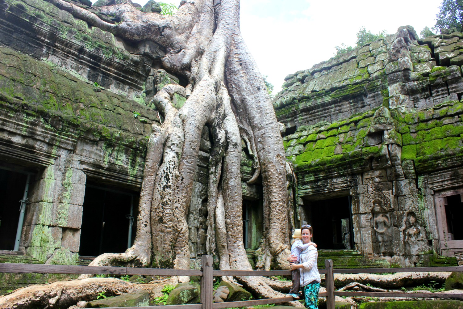 My daughter and I by one of the Spung trees at Ta Prohm temple - visiting Ta Prohm with kids