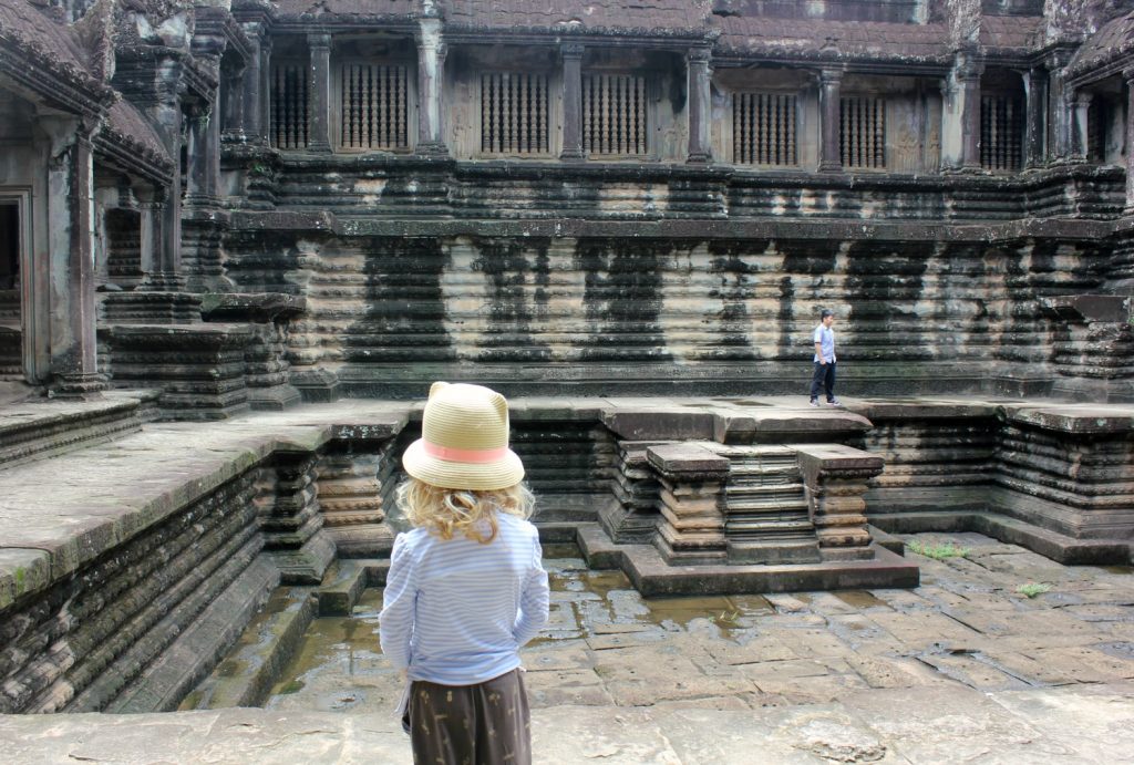 My daughter looks out across a sunken section in the middle of one of the Angkor temples