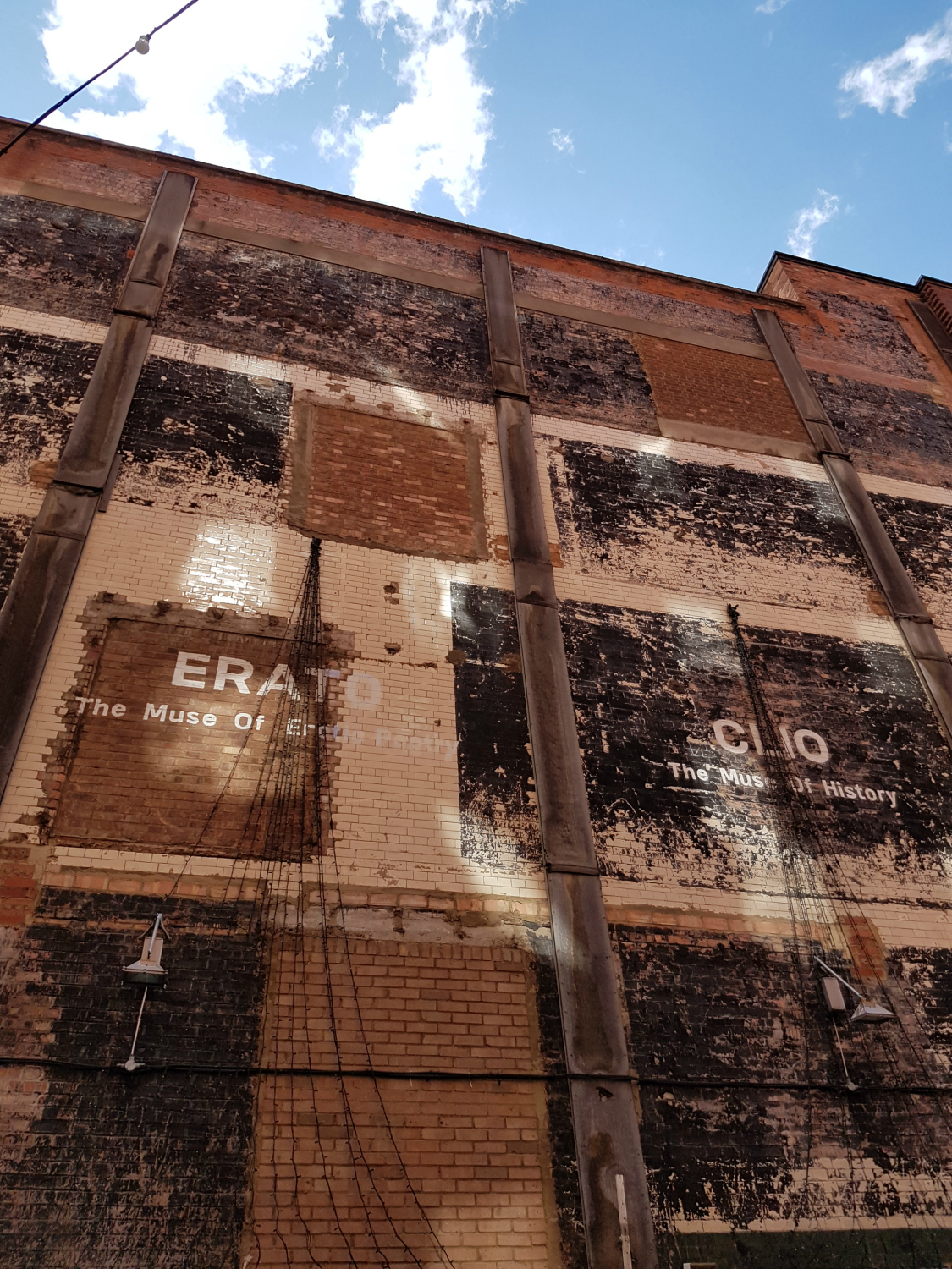 The stripped brick walls bearing the names of the Muses - my London Instawalk along the South Bank
