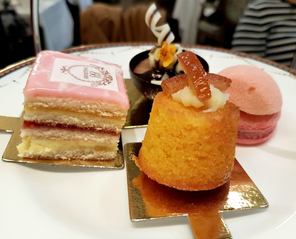 Close up of the four cakes on top of a tiered stand - my review of Waldorf Hilton afternoon tea