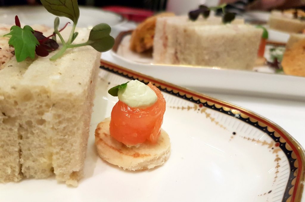 Smoked salmon blini and a plate of sandwiches - my review of Waldorf Hilton afternoon tea