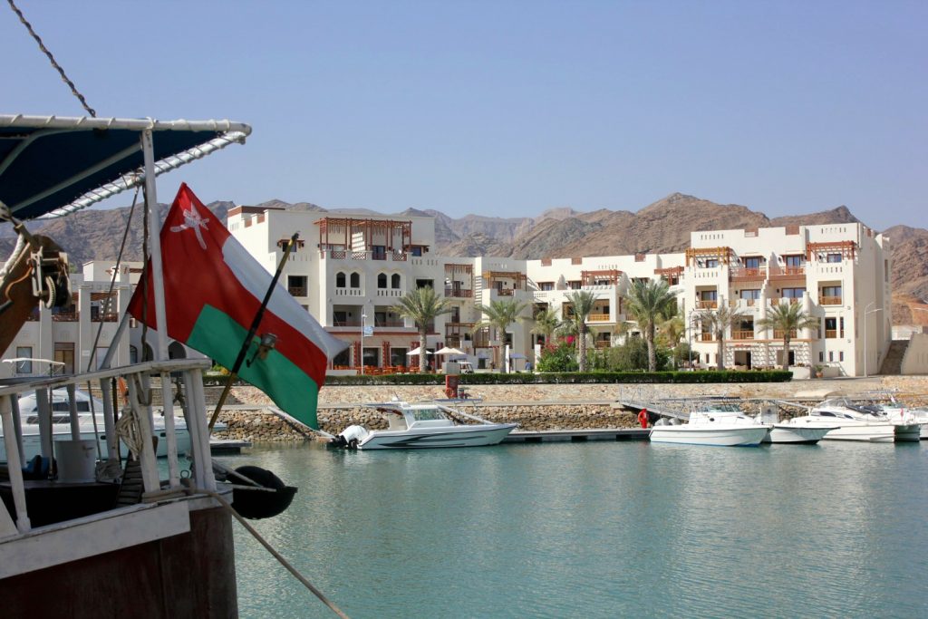 An Omani flag flying on a boat in the marina at As Sifa, near Muscat in Oman - my nine reasons to visit Oman with kids