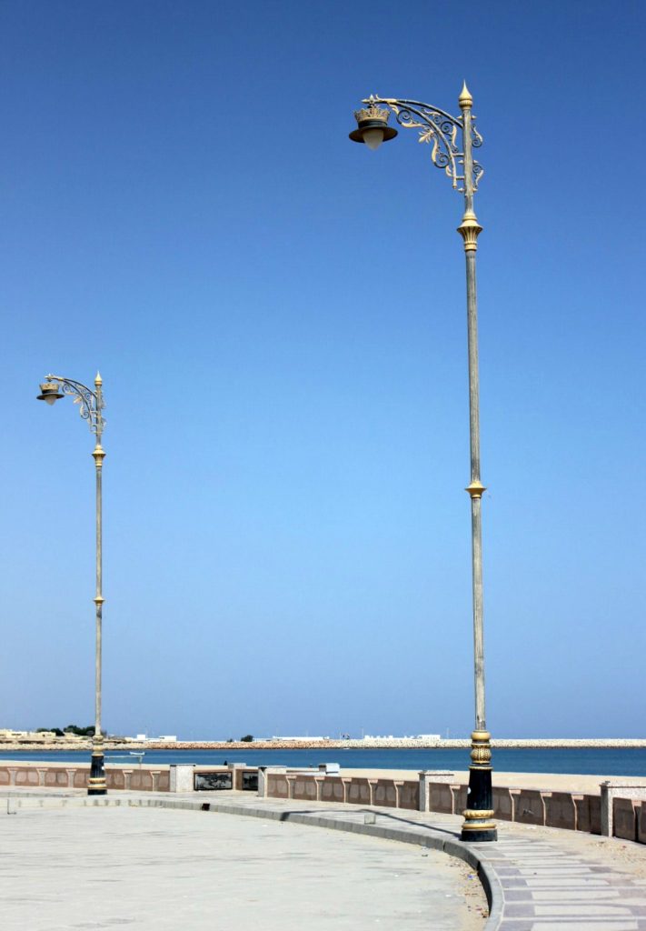 Ornate lampposts against a blue sky on the Corniche at Sur in Oman - my nine reasons to visit Oman with kids