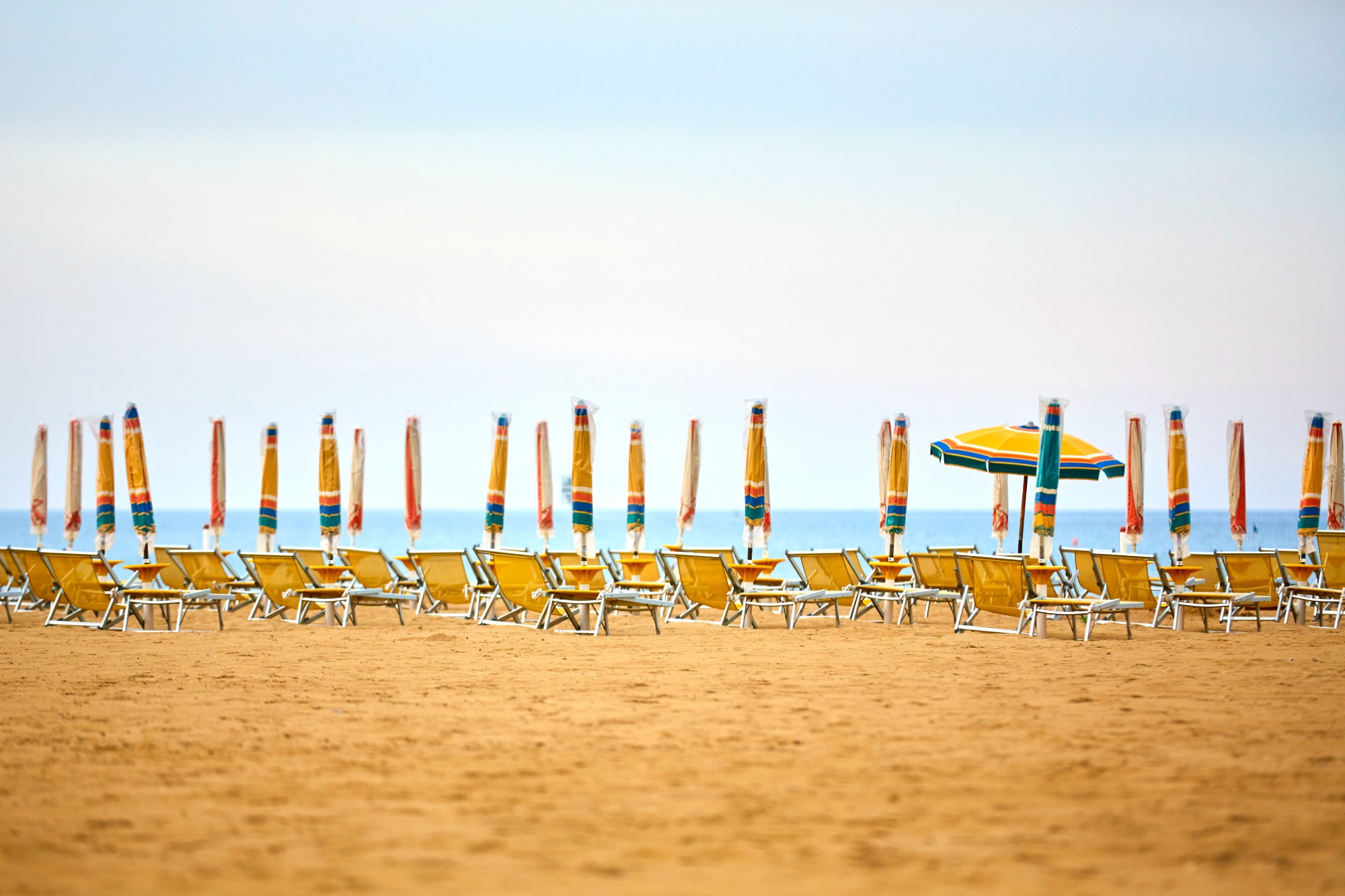 Empty sun lounges and all closed but one open parasols on the beach - why it's worth considering Bibione with kids if you visit Italy's Veneto region