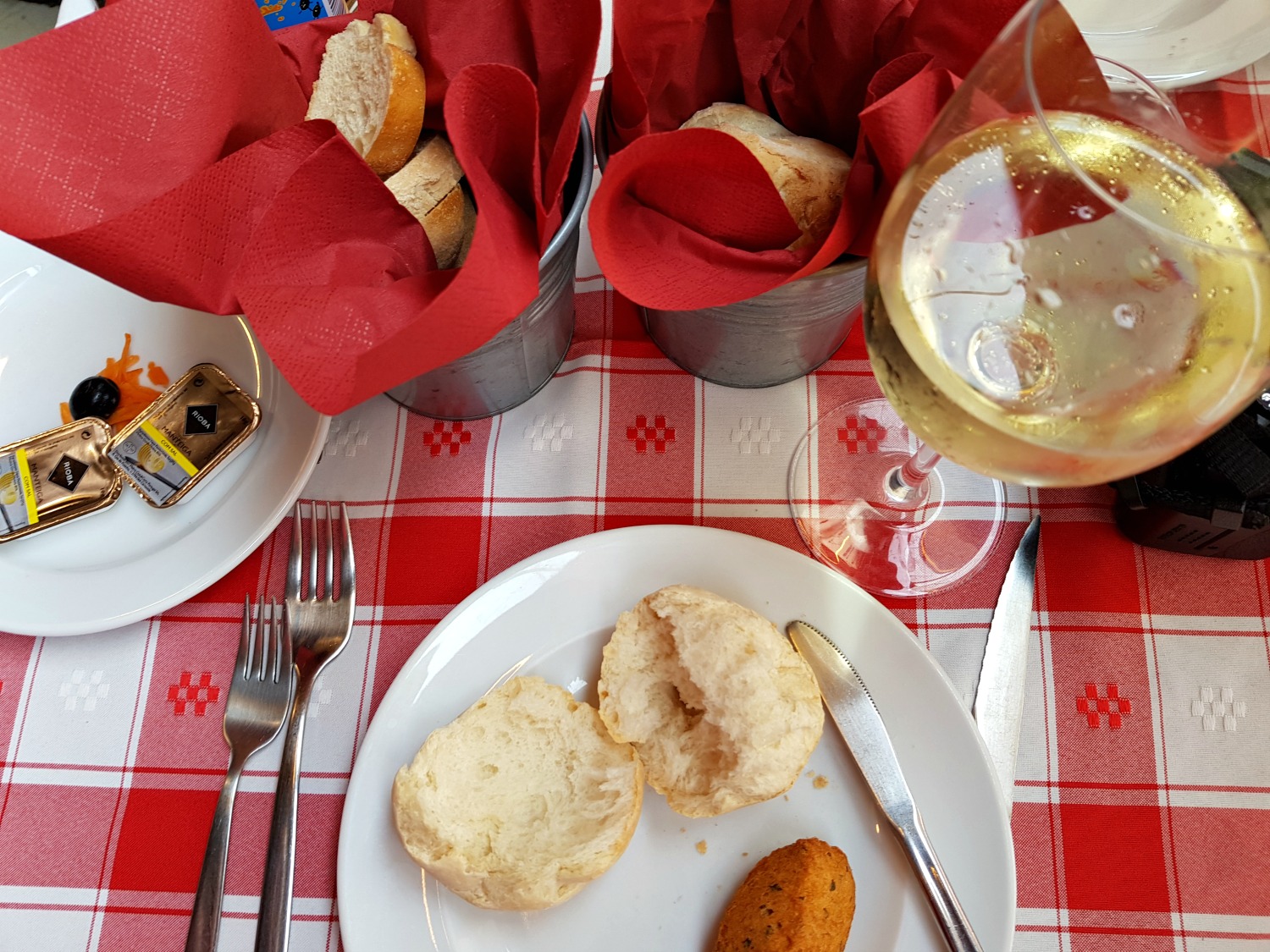 Starting a long lunch in Porto with bread and other snacks as part of the covert - my Porto travel tips and lessons for visiting the city with kids