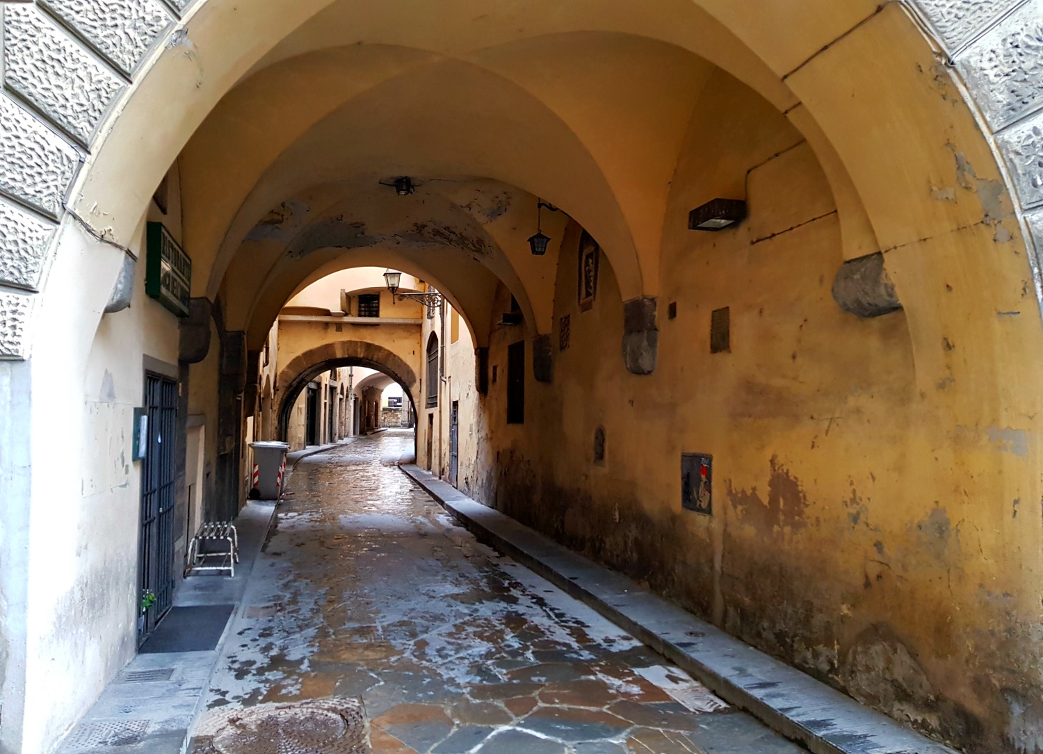 Alleyway leading through a tunnel in Florence, Italy - my Uffizi tour with kids and gelato making day in Florence