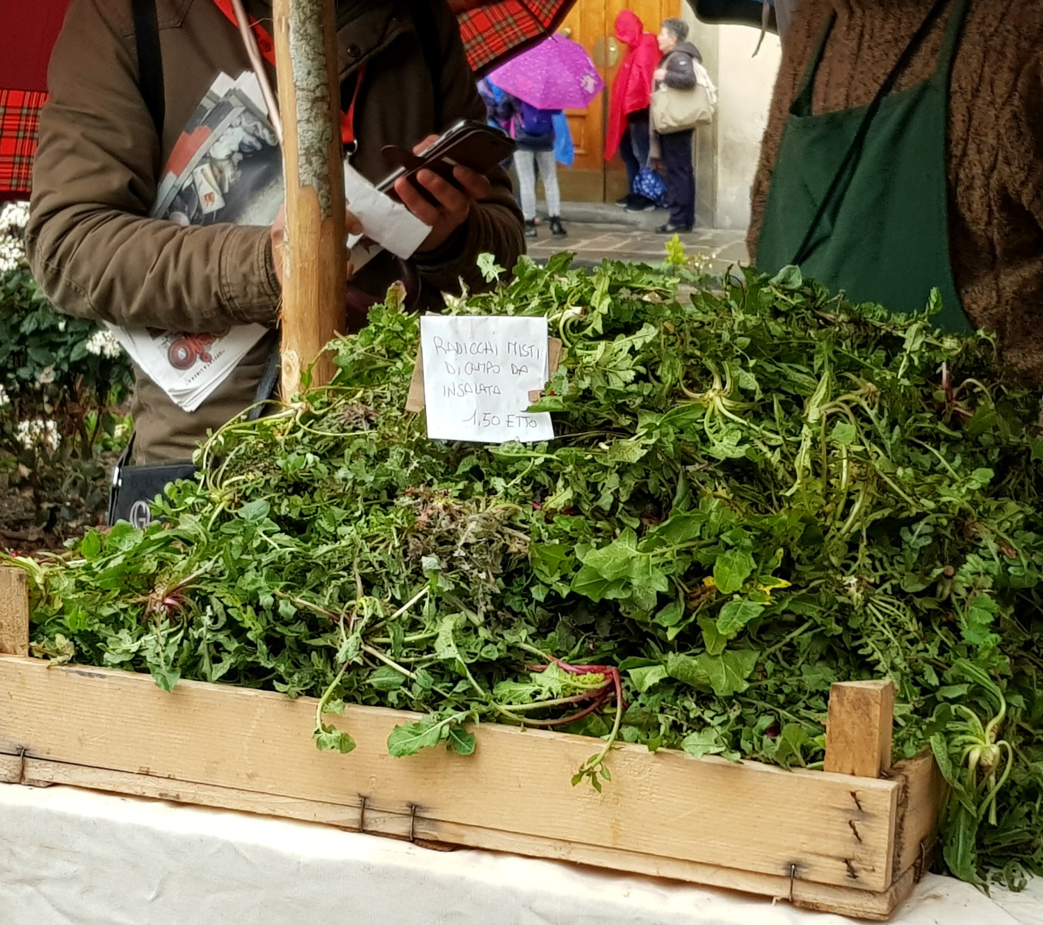 Piles of leaves for sale at a farmer's market in Florence, Italy - my Uffizi tour with kids and gelato making day in Florence