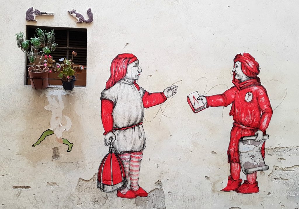 Street art showing figures in traditional dress in Florence, Italy - my Uffizi tour with kids and gelato making day in Florence