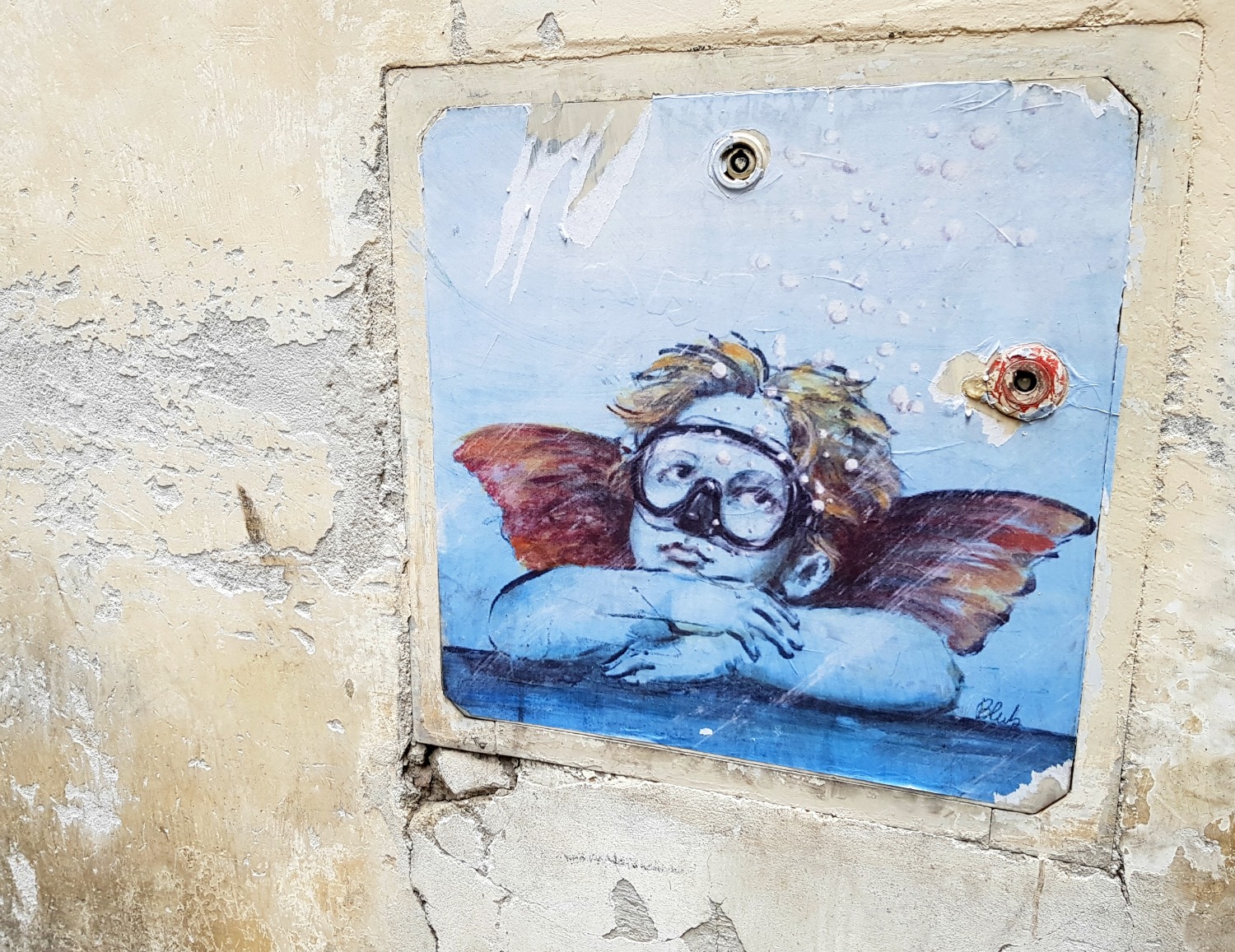 Updated cherub street art in Florence, Italy - my Uffizi tour with kids and gelato making day in Florence