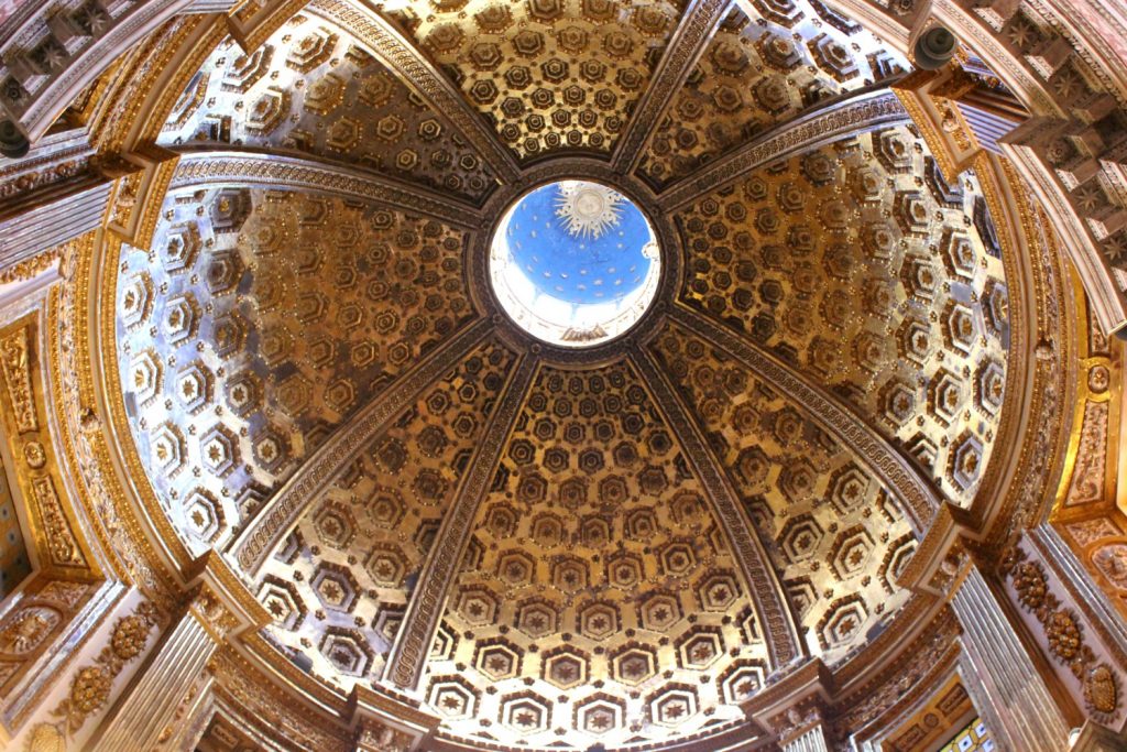 Looking up into the gilded dome in a chapel at the cathedral - exploring Siena with kids, our tour discovering art, history and animals