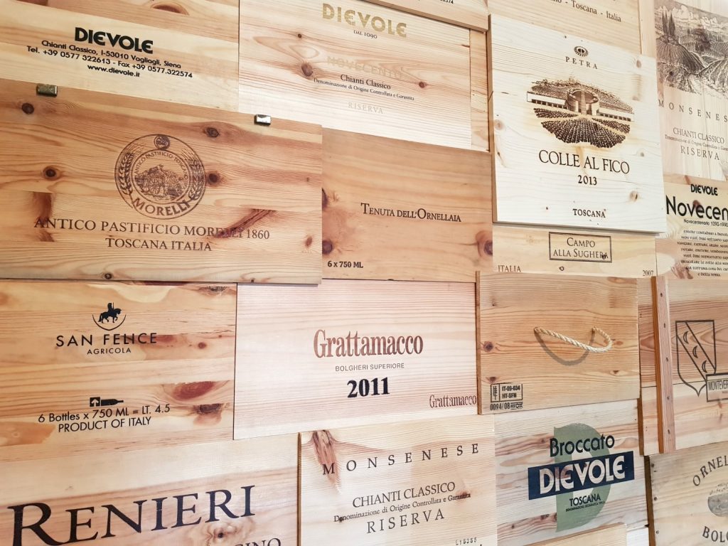 Old wooden wine boxes used as decoration at Villa Le Capanne near Volterra in Tuscany - my review of the perfect big family villa in Tuscany, Italy