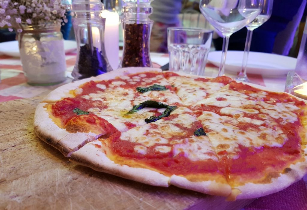 Pizza night with freshly oven-baked pizzas at Villa Le Capanne near Volterra in Tuscany - my review of the perfect big family villa in Tuscany, Italy